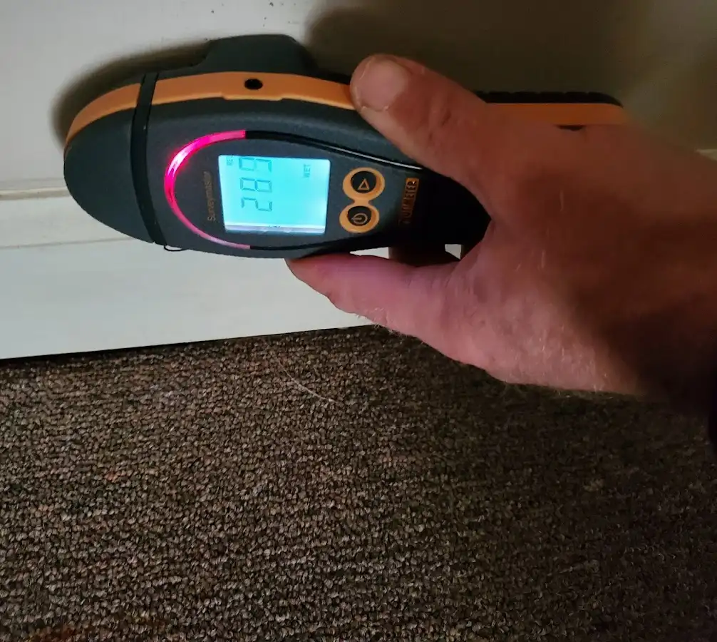 Moisture detection at baseboard during Storm Damage Restoration in Wahpeton